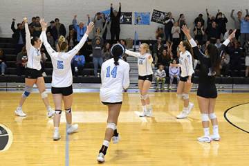 Hopkins volleyball players celebrate a point