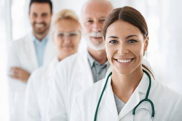 Group of four doctors looking at the camera