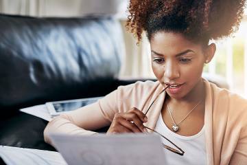 Woman looking at financial documents