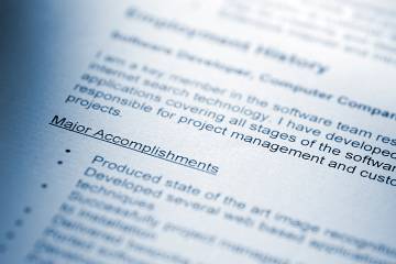 Closeup of a resume listing accomplishments