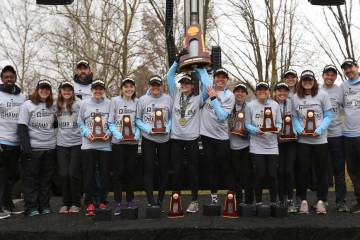 Johns Hopkins women's cross country team with NCAA championship trophy