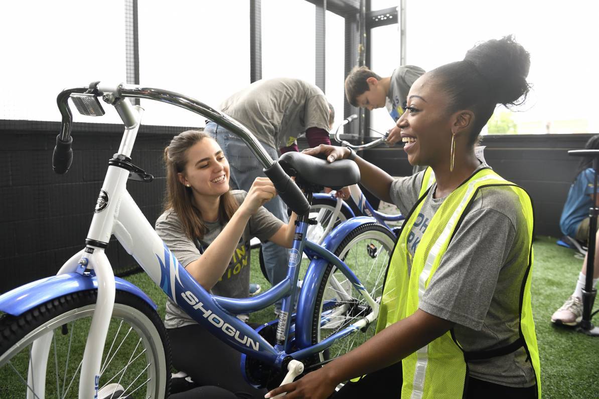 Volunteers build bikes