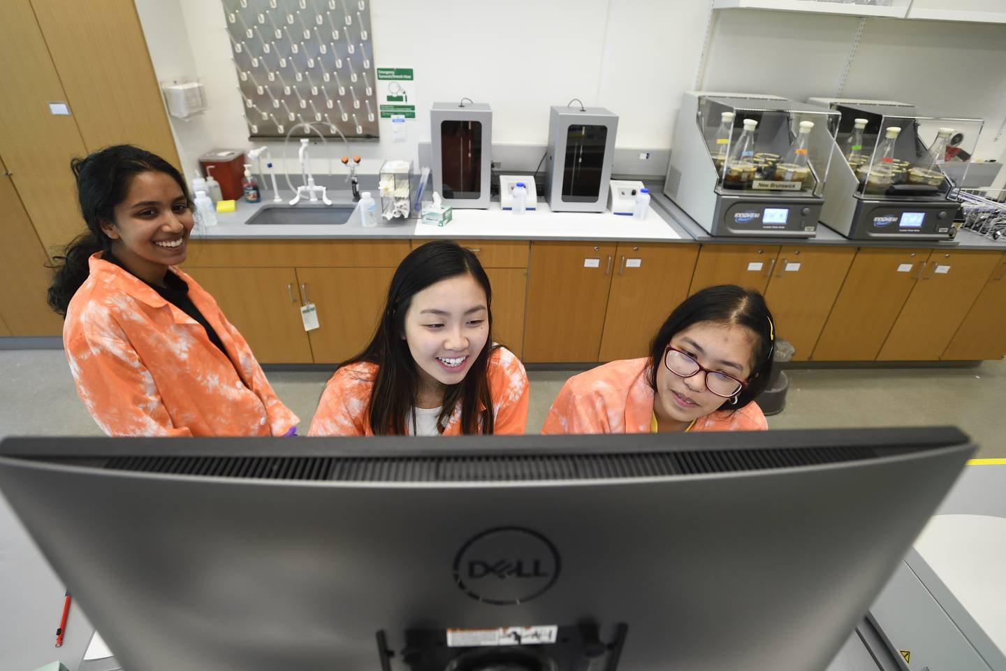 Students in tie-dyed lab coats