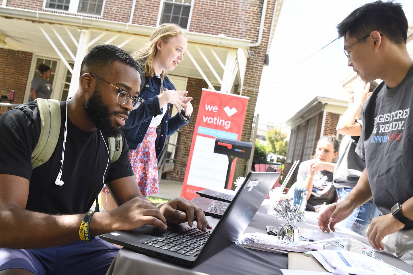 A student registers to vote