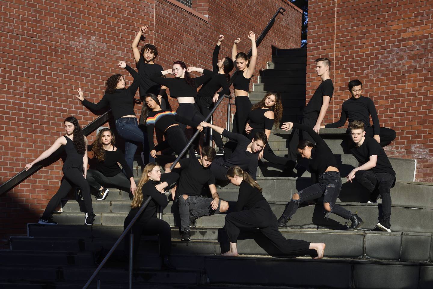 Students pose in dance poses