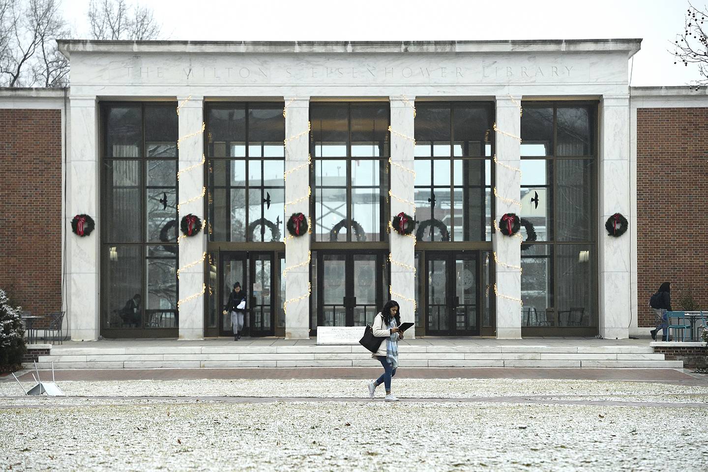 Student walks in the snow outside MSE Library