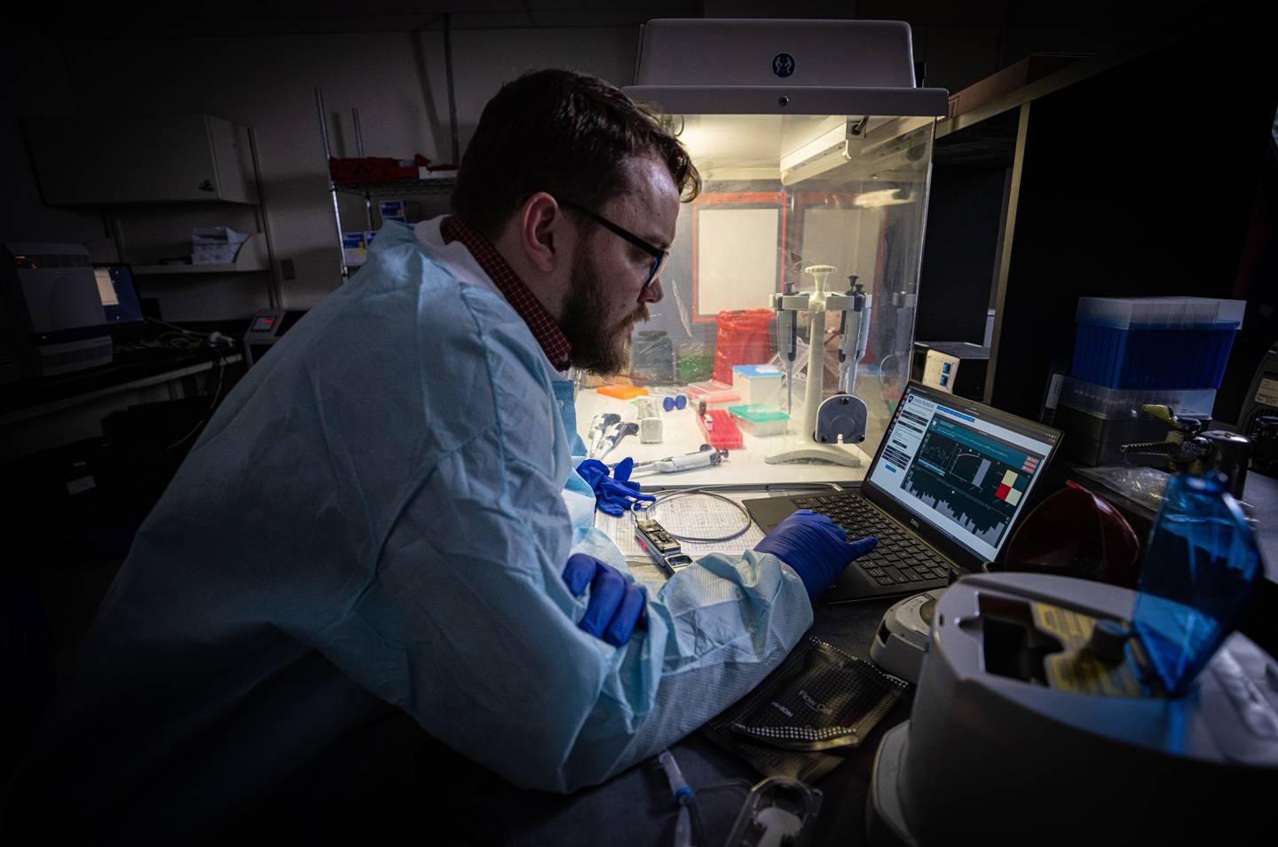 APL biologist Tom Mehoke reviews the DNA sequencing analysis of SARS-CoV-2, the virus causing COVID-19, at the molecular diagnostics laboratory at Johns Hopkins Hospital.