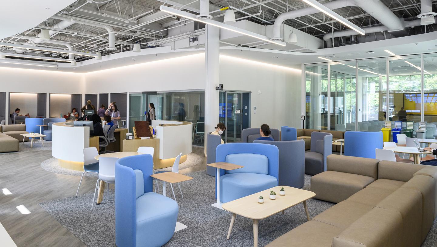 The interior of the Imagine Center features squashy chairs, desks, and couches for working