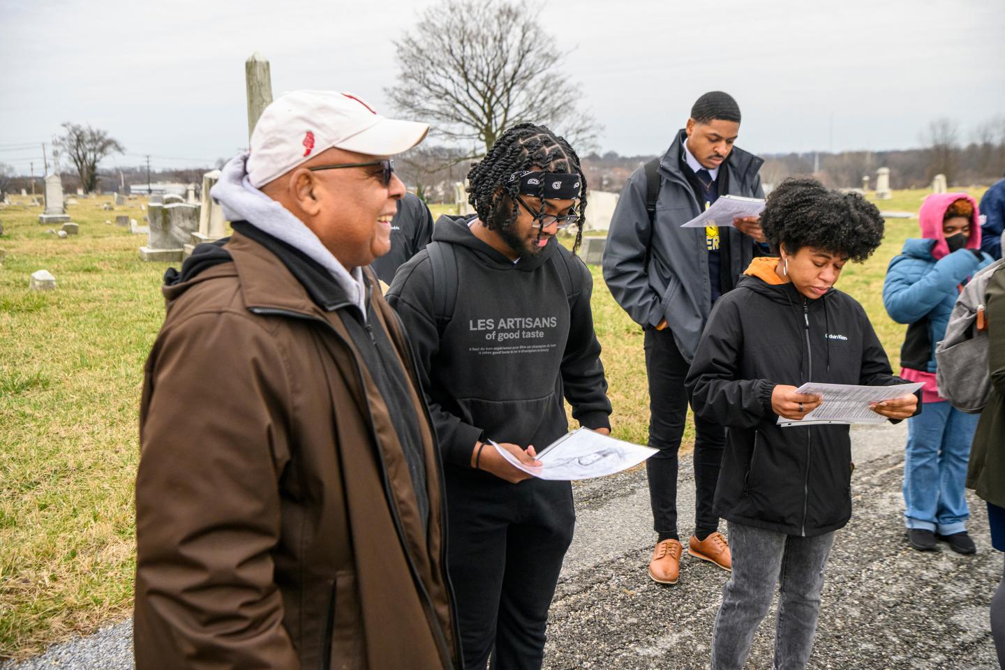 An instructor leads a discussion with students in Mount Auburn Cemetery