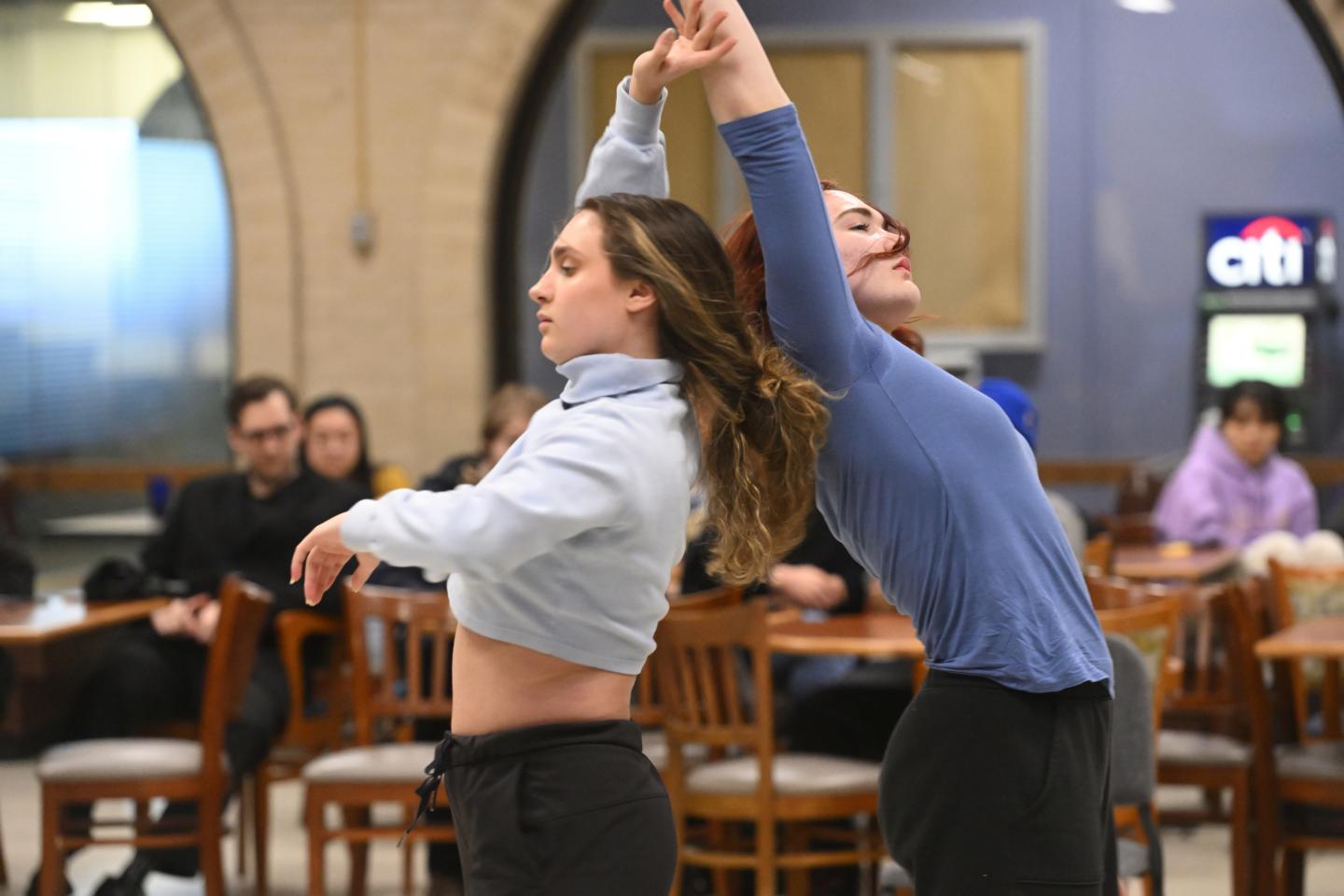 Dancers perform in the Peabody cafeteria 