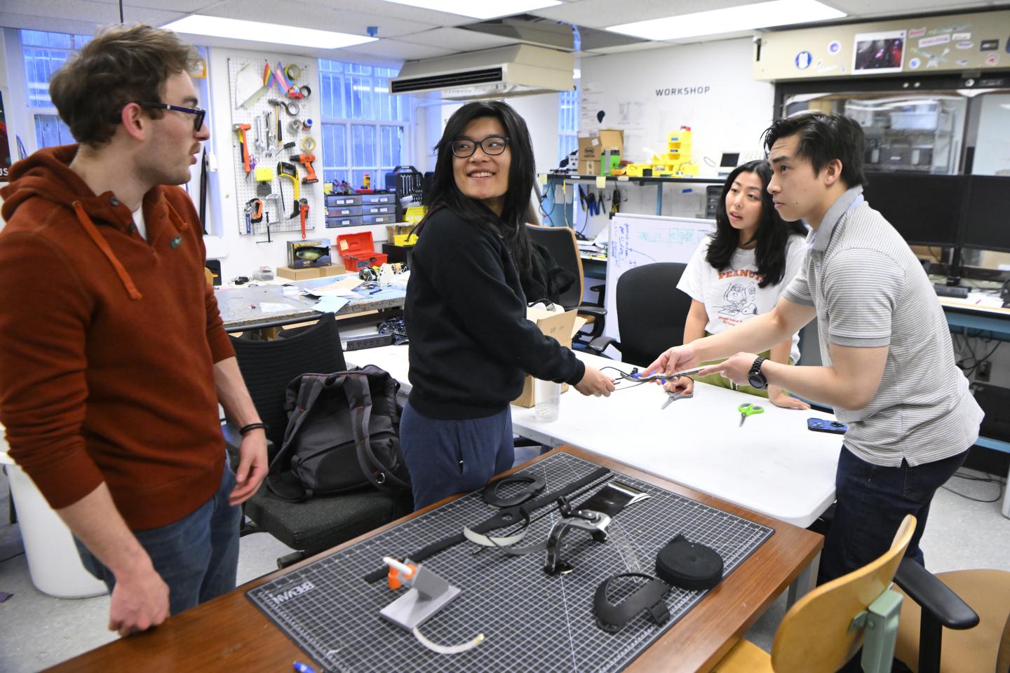 JHU engineering students work together in the lab on their design project to help a local artist 