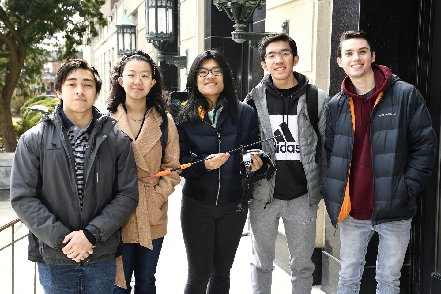 JHU engineering students pose for a group photo with their project