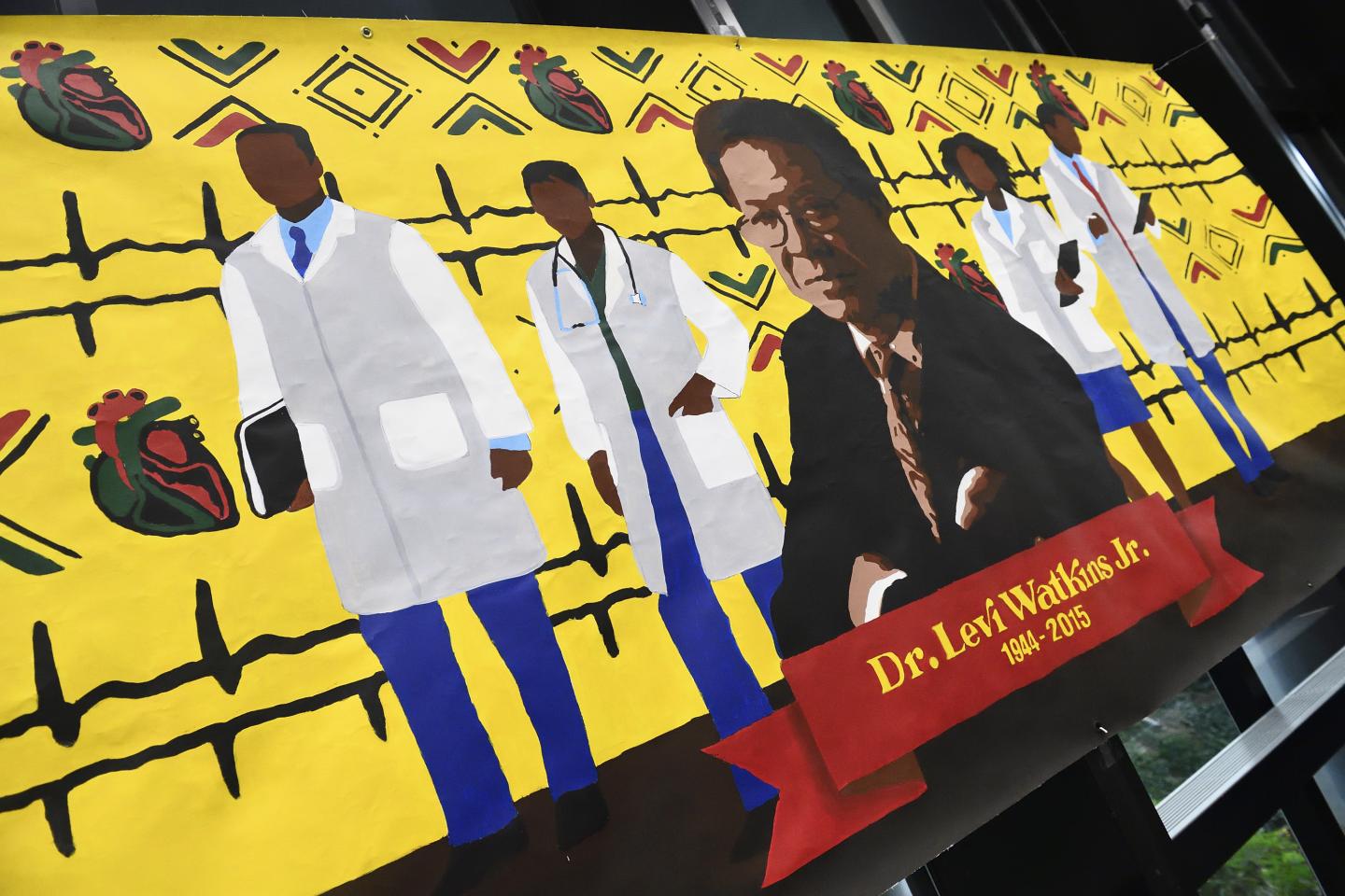 A yellow mural of Levi Watkins