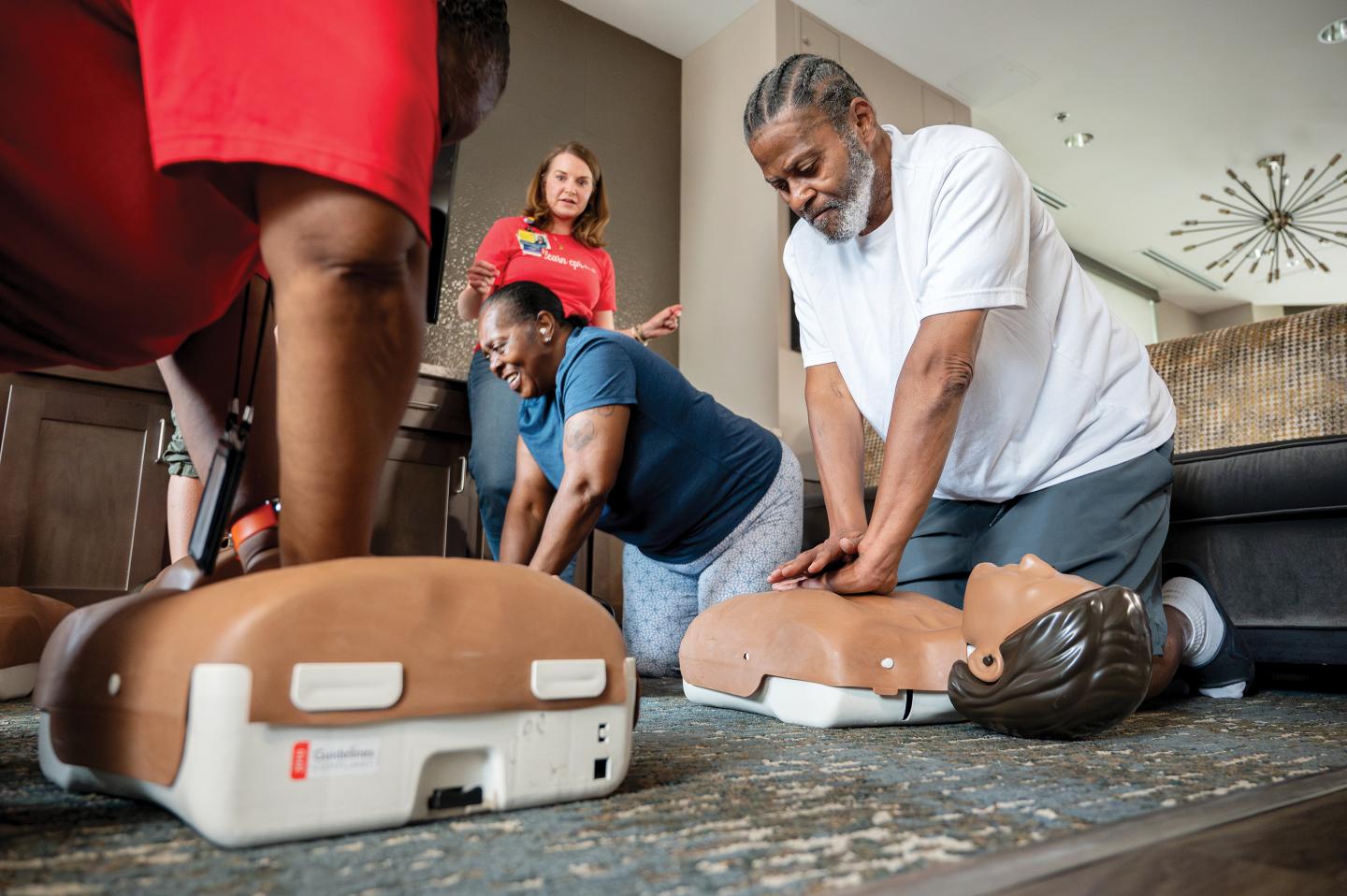 Local residents take part in a community-based CPR workshop
