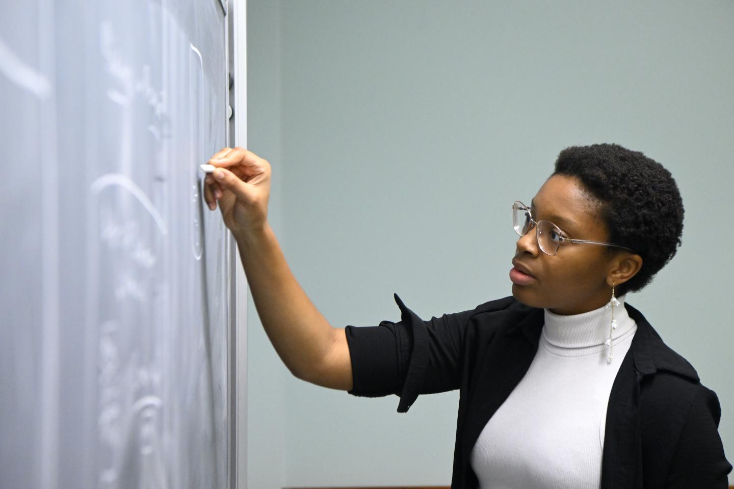 HopHacks student at a chalkboard