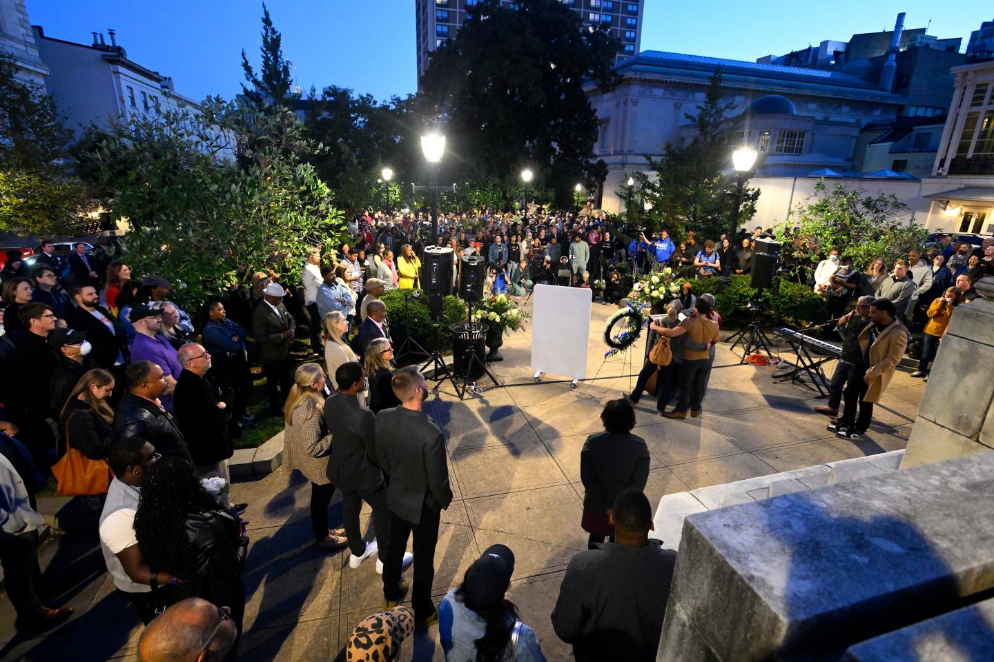 A group of people gather at Baltimore's Washington Monument for a vigil