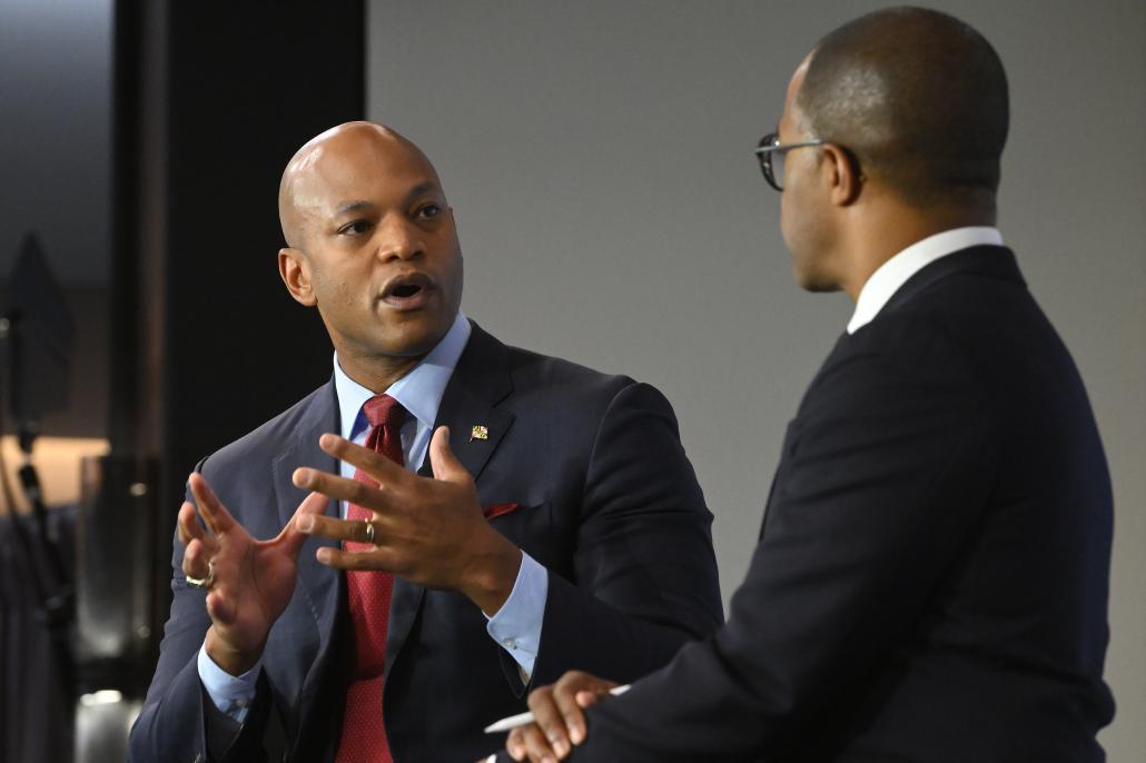 Maryland Governor Wes Moore talks to another person.