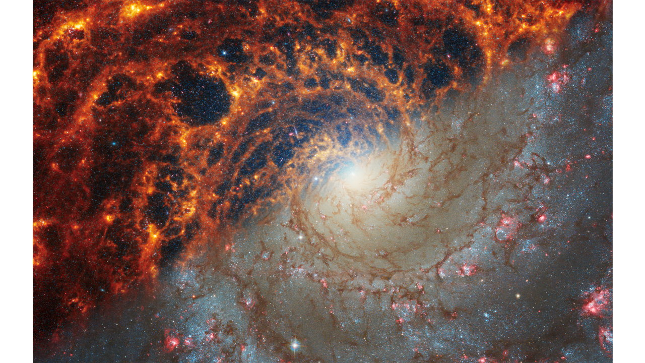  Two observations of a portion of the galaxy NGC 628 are split diagonally, with Webb’s observations at top left and Hubble’s at bottom right.