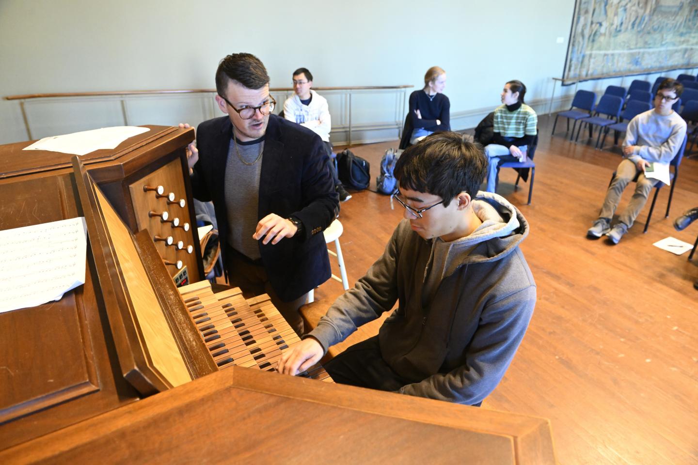 Jordan Prescott and a student play the organ in Griswold Hall
