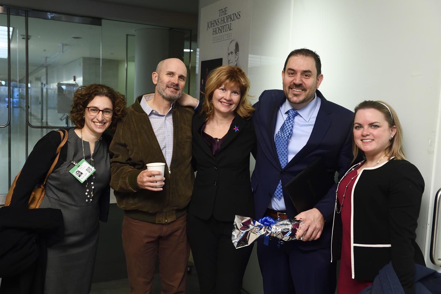 Joseph Sakran celebrates with colleagues after receiving the President's Frontier Award