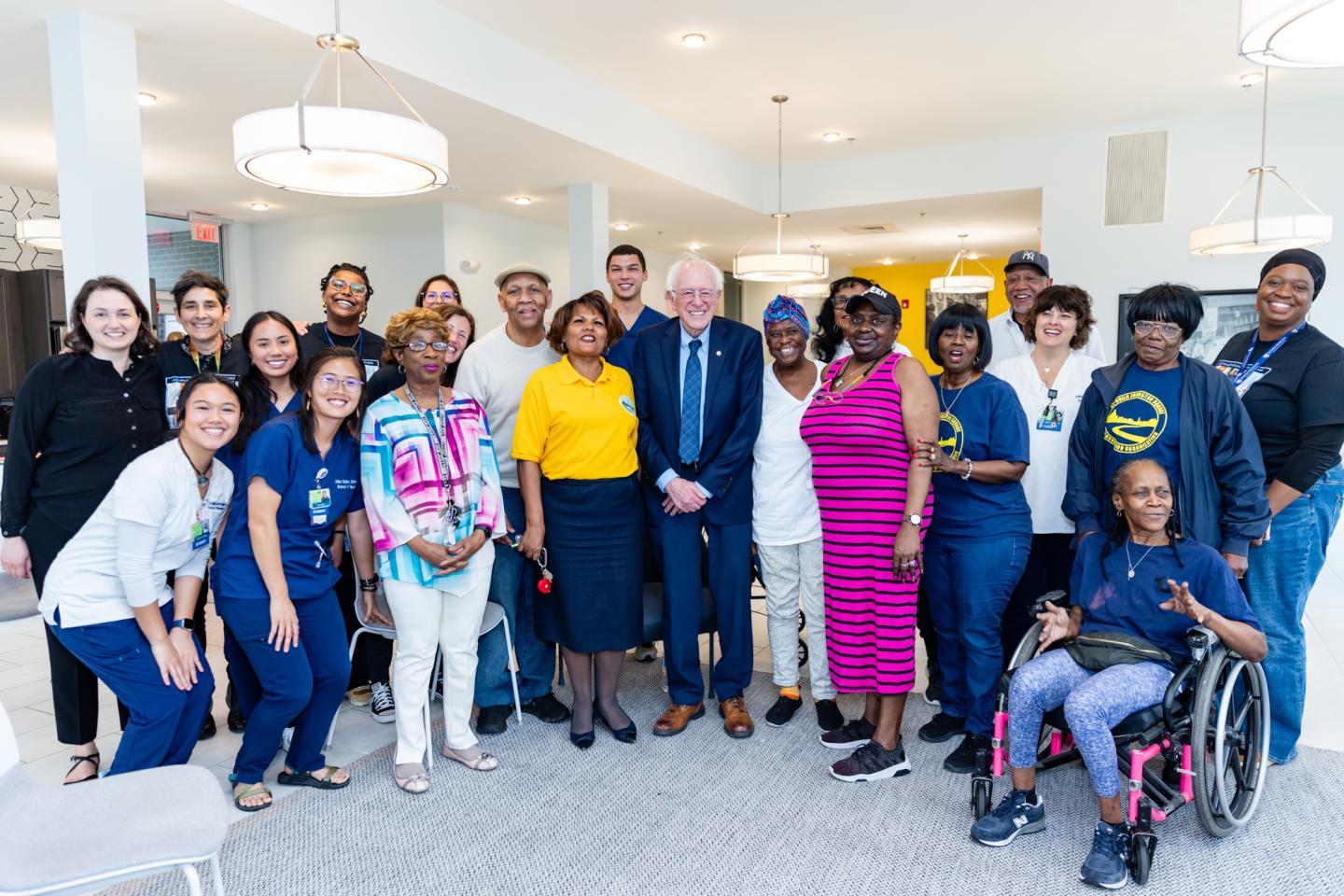 U.S. Sen. Bernie Sanders poses with a group of Baltimore residents.