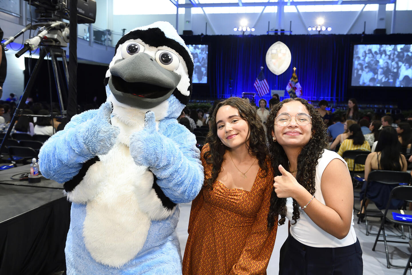 Jay poses with students at Convocation 2024