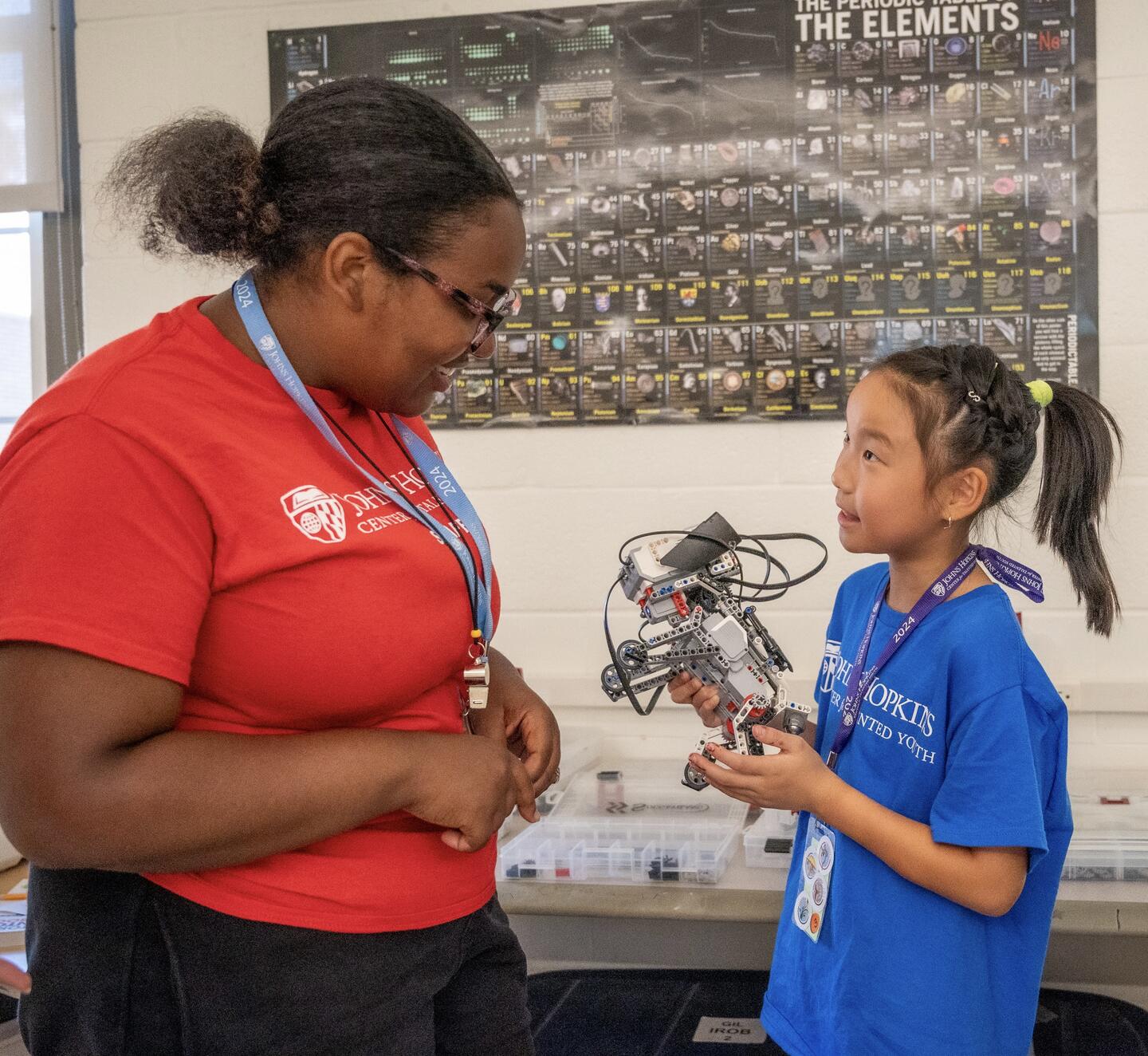 CTY student Sunny Chang talks with her instructor in the Introduction to Robotics course at CTY’s on-campus site at Gilman School in Baltimore