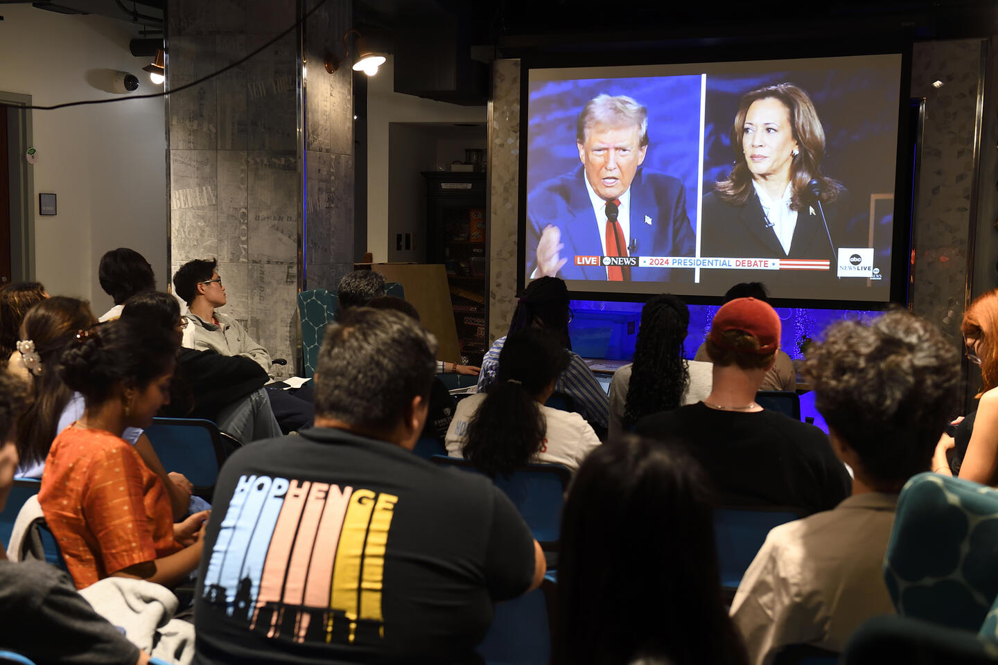 Students gather in front of a big-screen TV to watch the presidential debate on Sept. 10