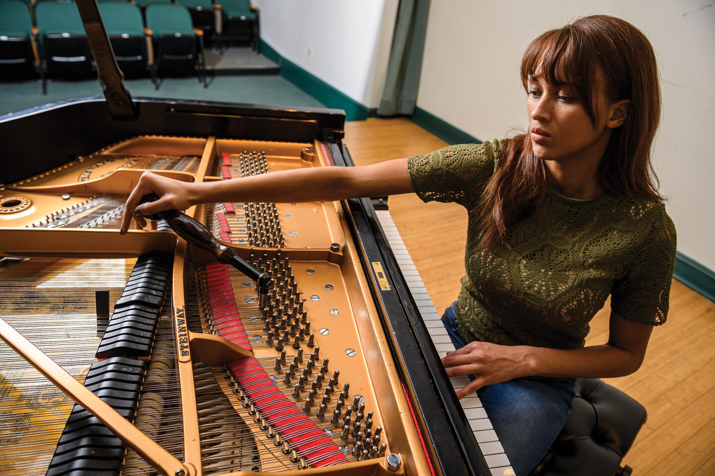 Renée Kelsey tuning a piano