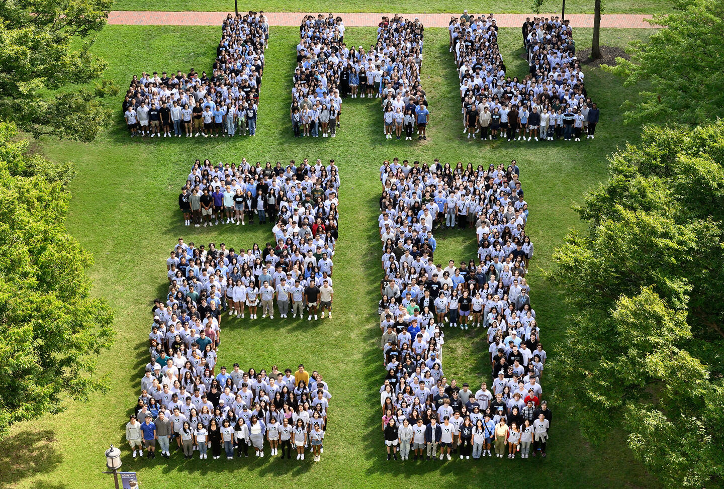 Johns Hopkins University Class of 2028 arrayed to spell JHU 28