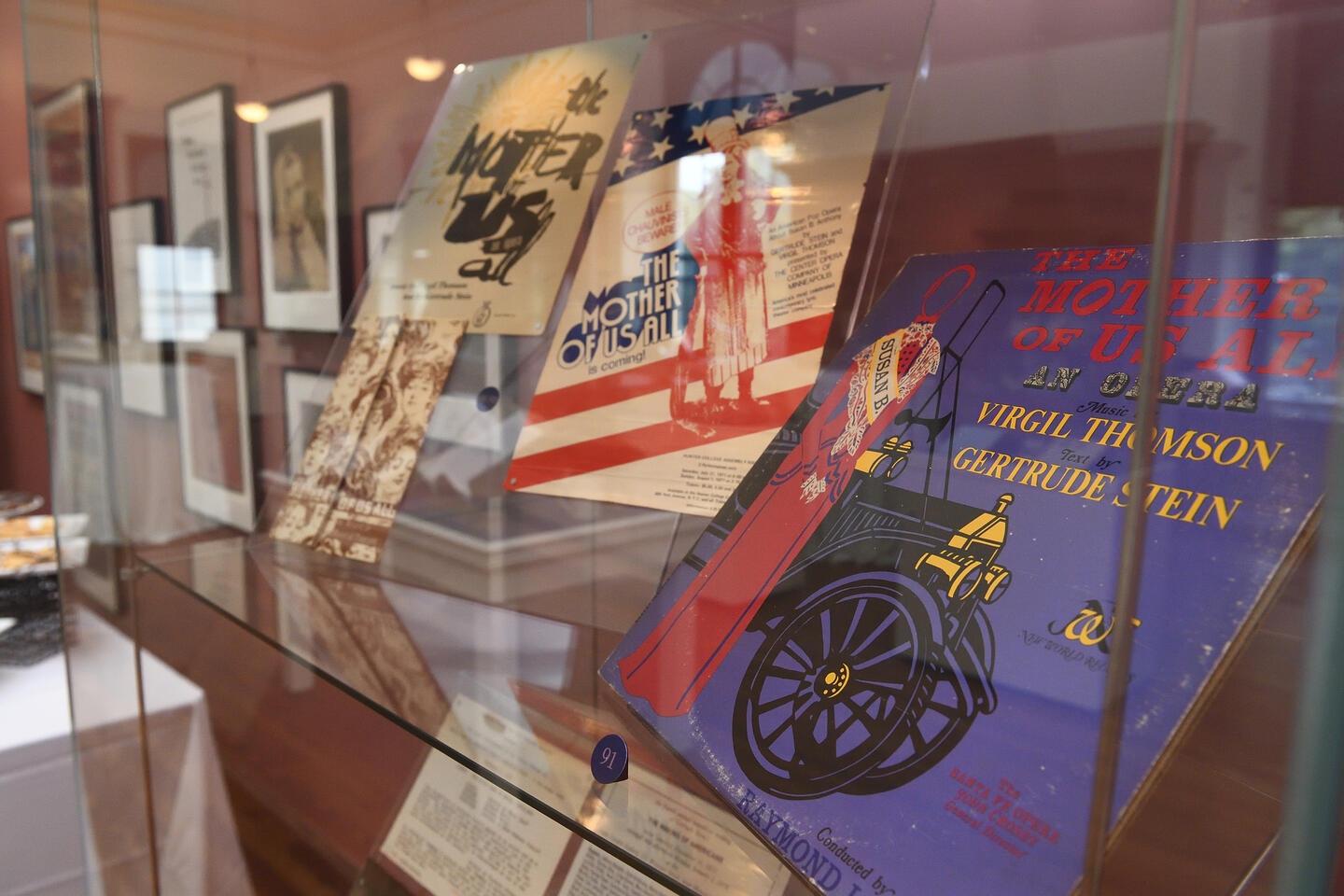 A display case filled with colorful items at the Gertrude Stein exhibit