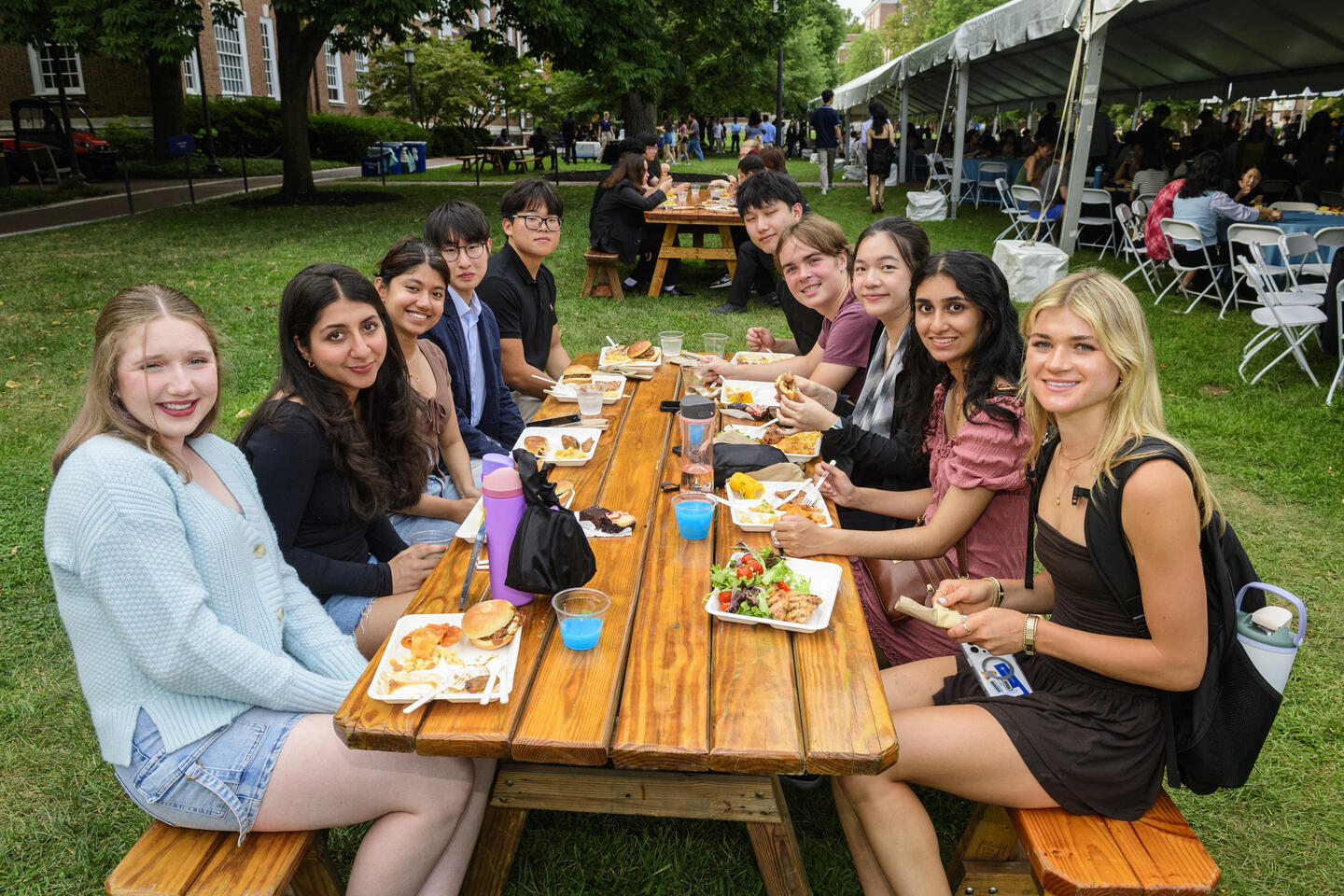 Students eating at a picnic table
