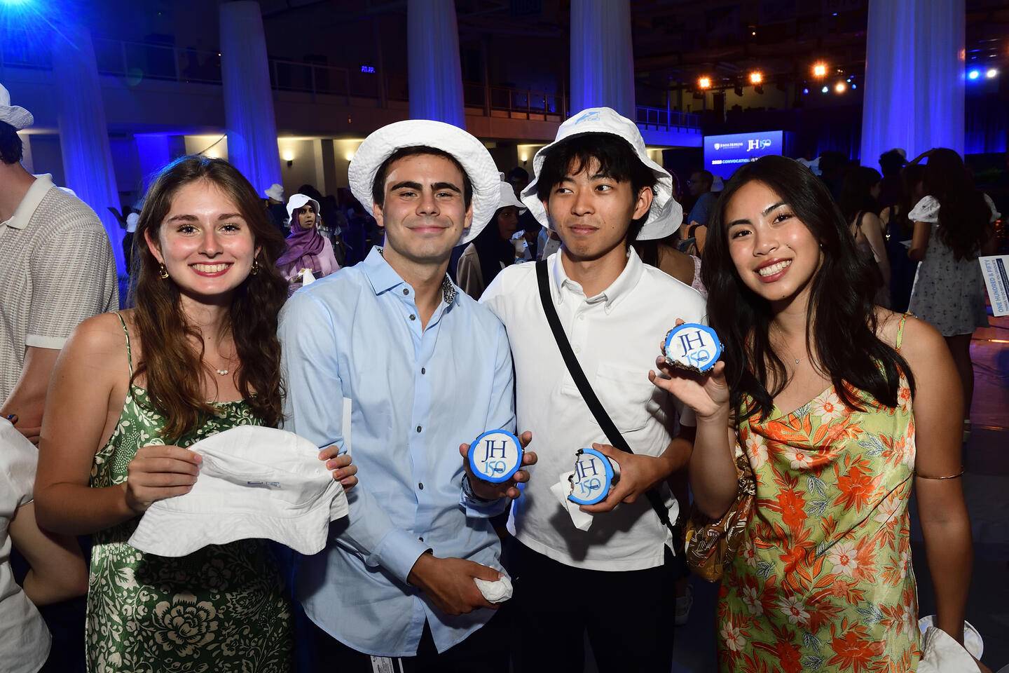 Students wearing bucket hats at Convocation
