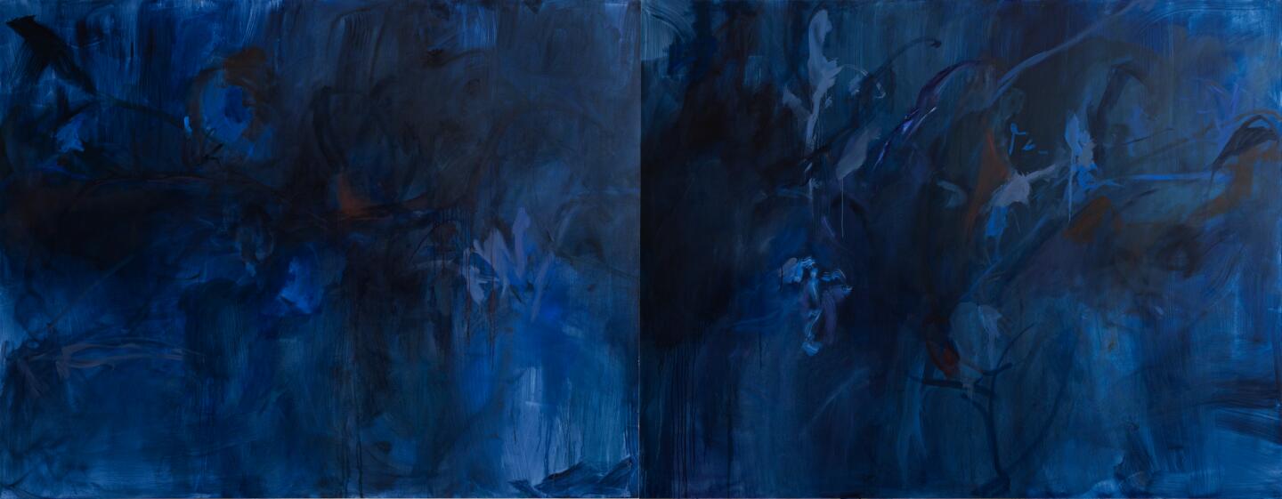A large, abstract work of art in varying tones, primarily dark blue