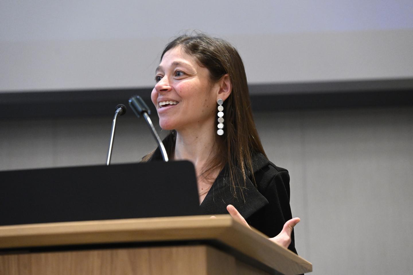 Jamie Spangler speaks at a podium.