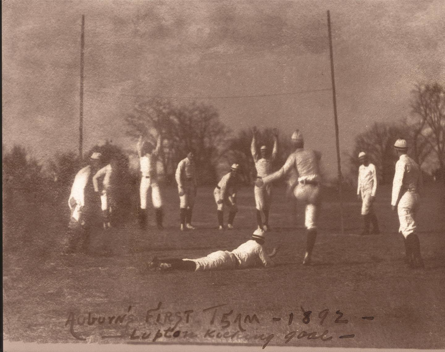 Old fashioned photo of men playing football