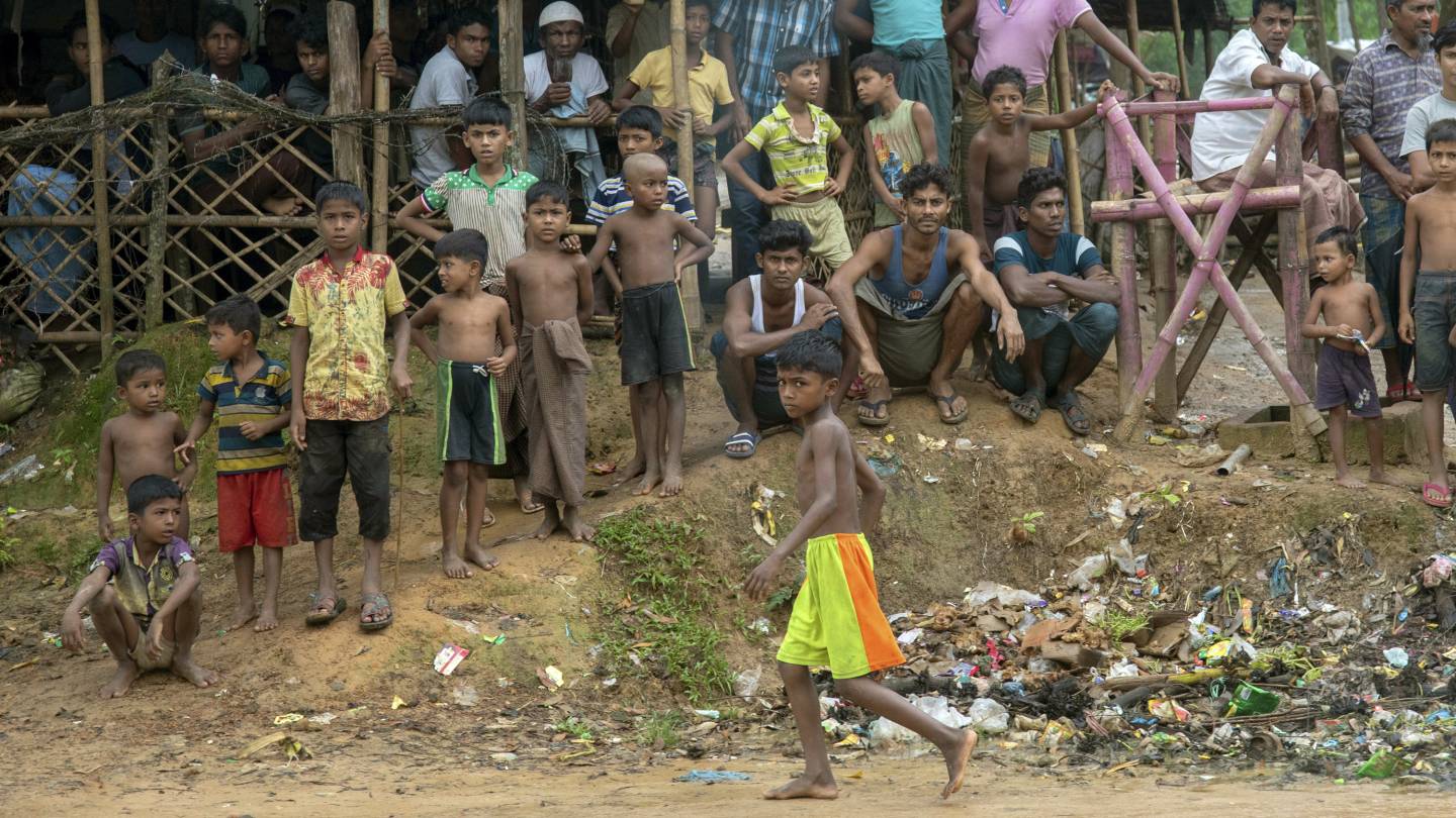 Rohingya men and boys gather together for a photograph