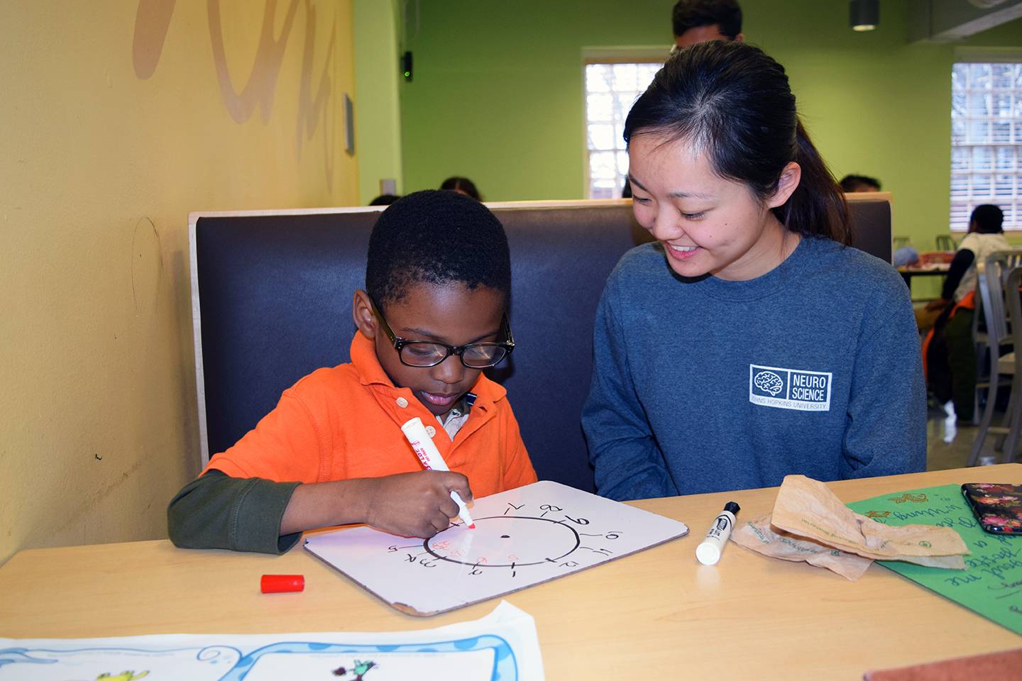 Hopkins student tutors an elementary-schooler
