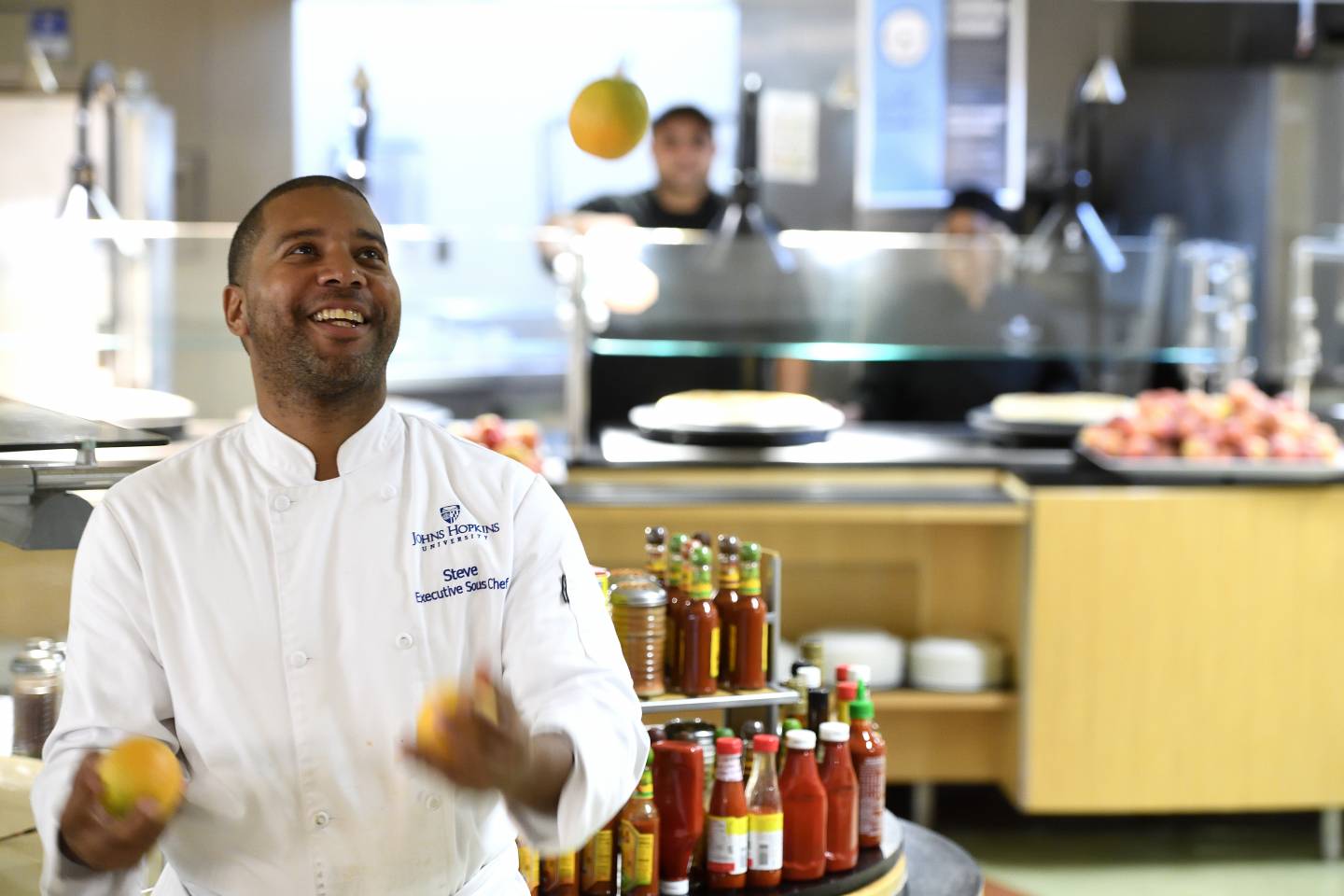 Executive Sous Chef Steve Paret juggles oranges