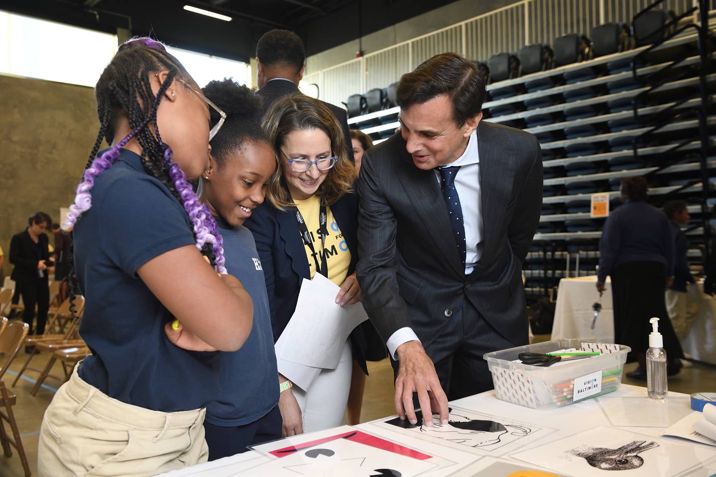 President Daniels and Megan Collins look at optical illusions with students