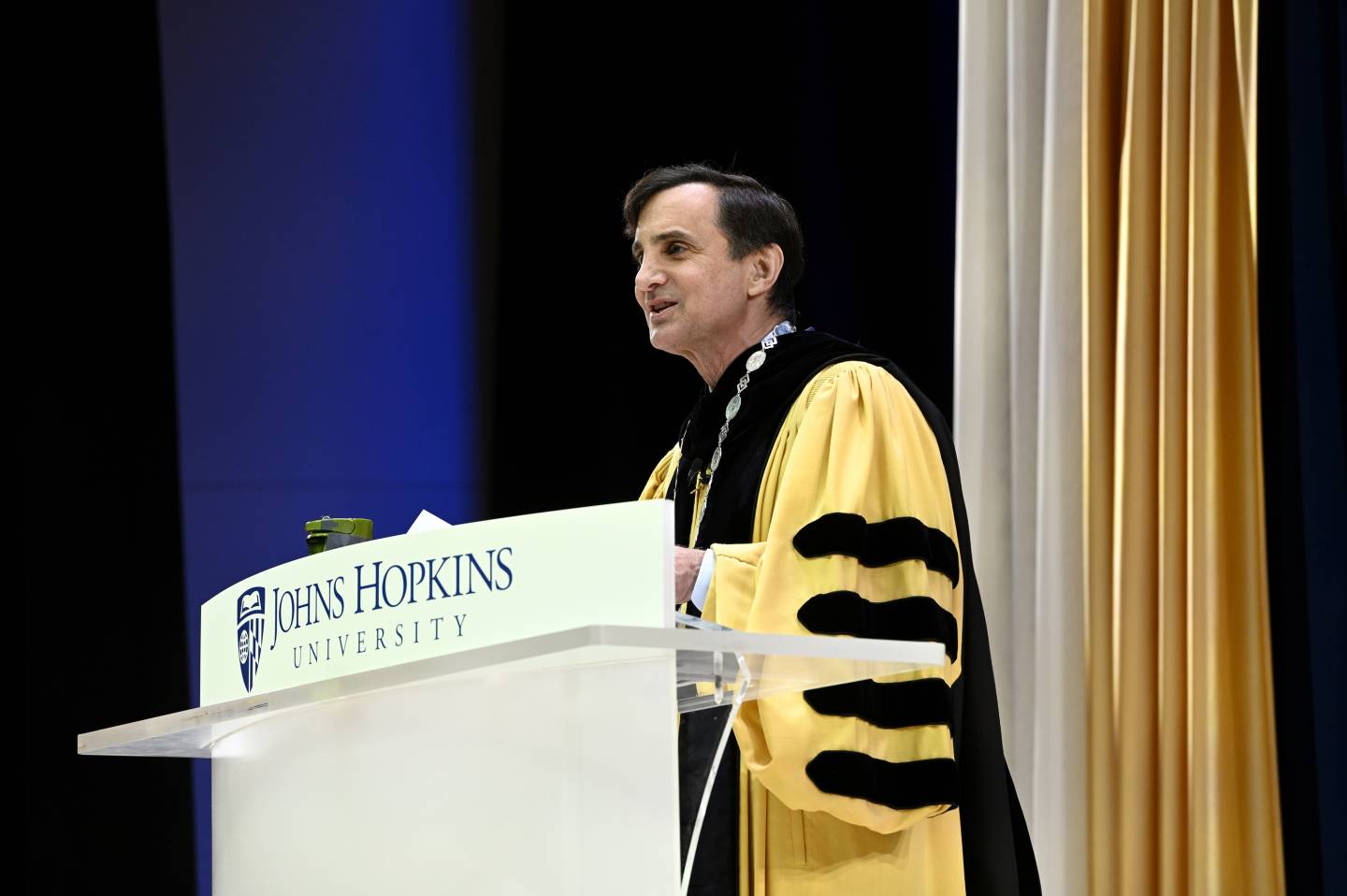 JHU President Daniels wears his customary Commencement regalia to give an address