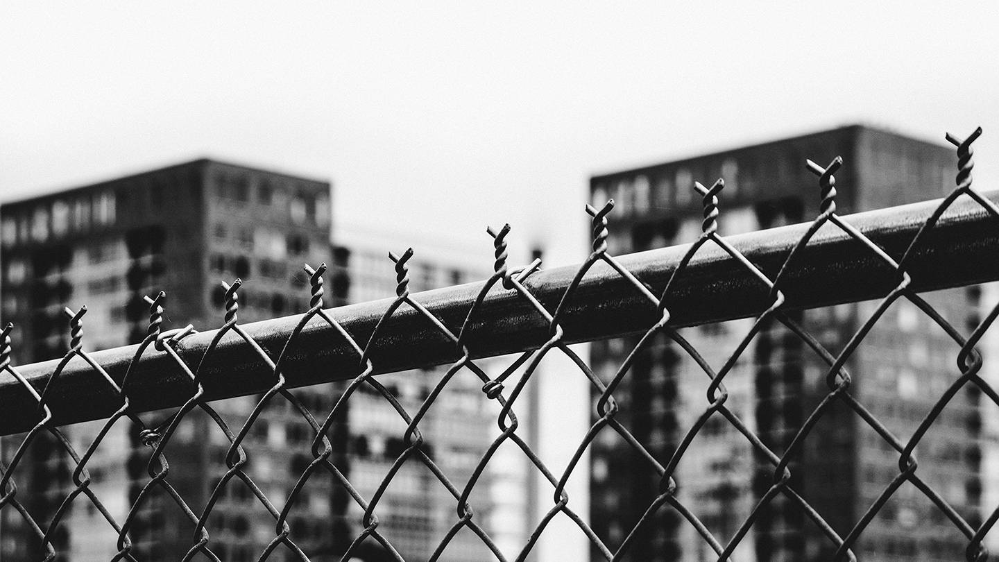Fence and highrise housing Fence and highrise housing