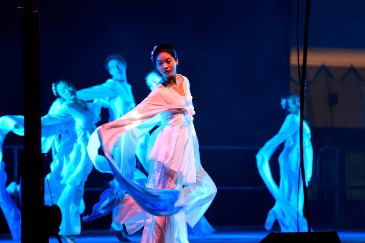 Students dance in traditional garb