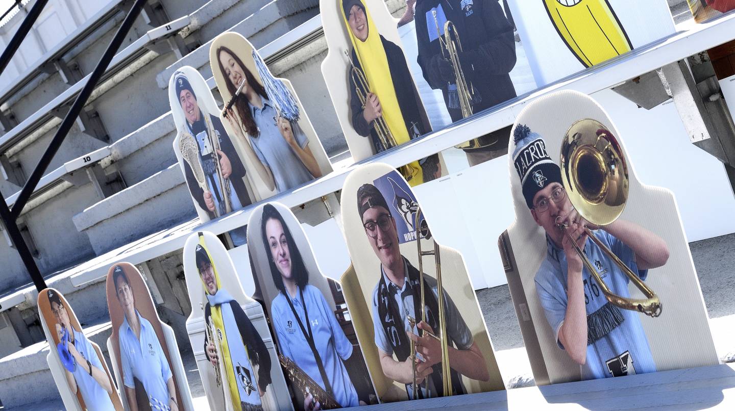 Cardboard cutouts show pep band members with their instruments