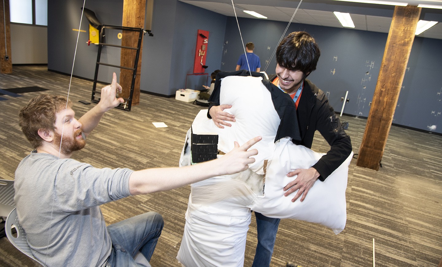 Students test hugging machine