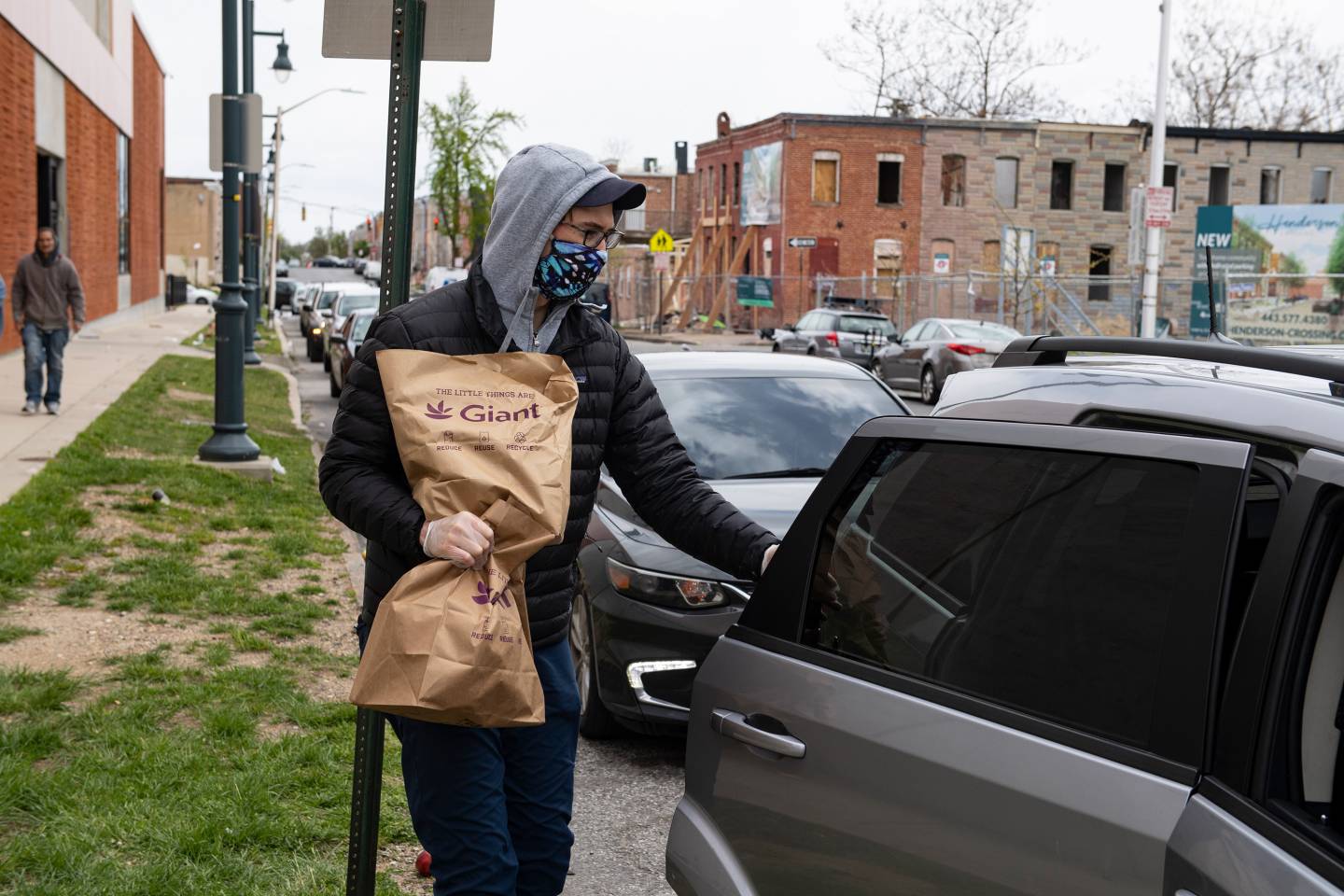 A man loads food into his car