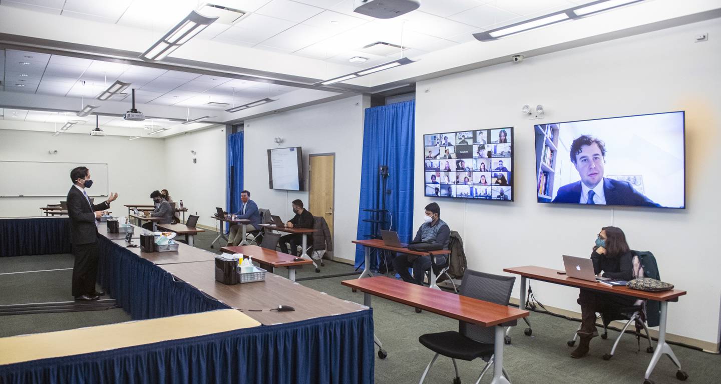 A hybrid virtual and in-person lecture is held at the Carey Business School