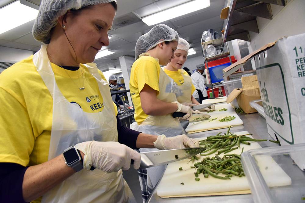 Volunteers prepare food