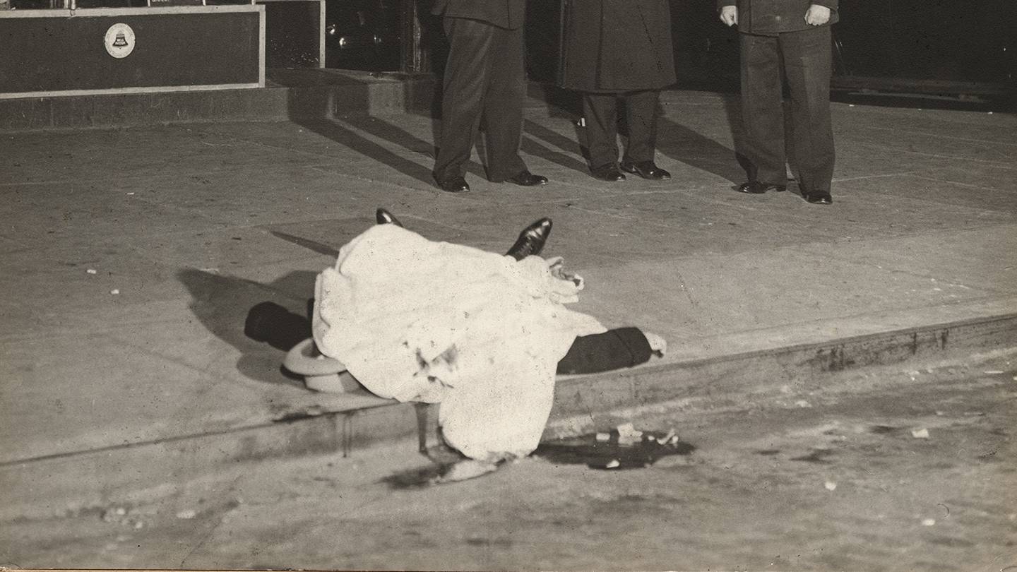 Detail of photo of dead body outside a diner Detail of photo of dead body outside a diner