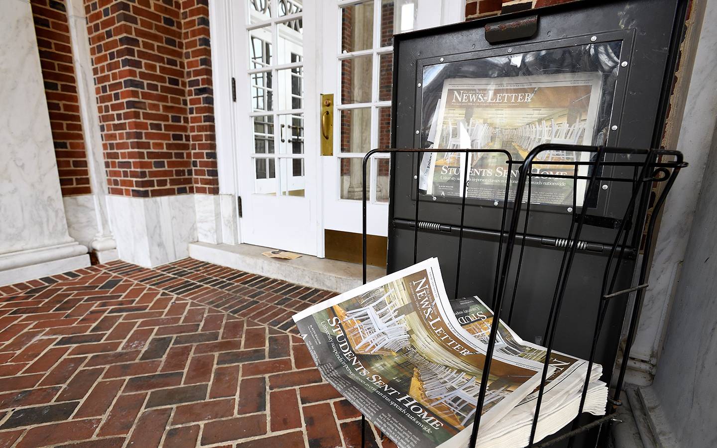 A newspaper stand holds the last issues of the News-Letter for the spring semester